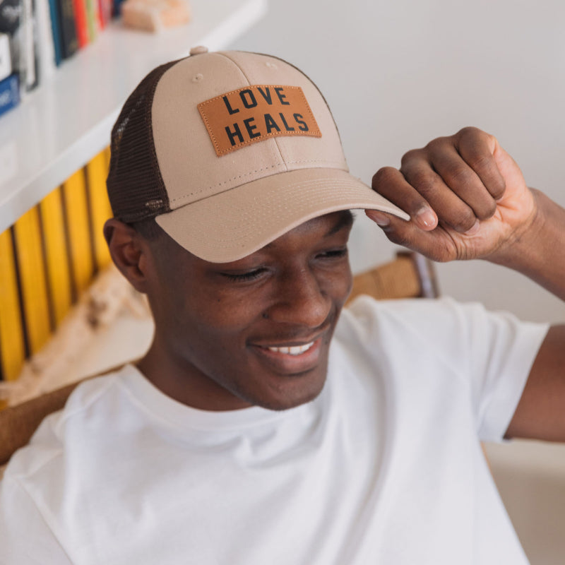 Love Heals Tan Trucker Hat
